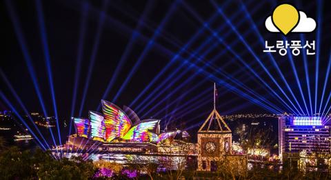 비비드 시드니 비비드 시드니(Vivid Sydney) 2018 기간 동안 시드니 오페라 하우스를 비추는 조너선 자와다의 메타매스매지컬(Metamathemagical)